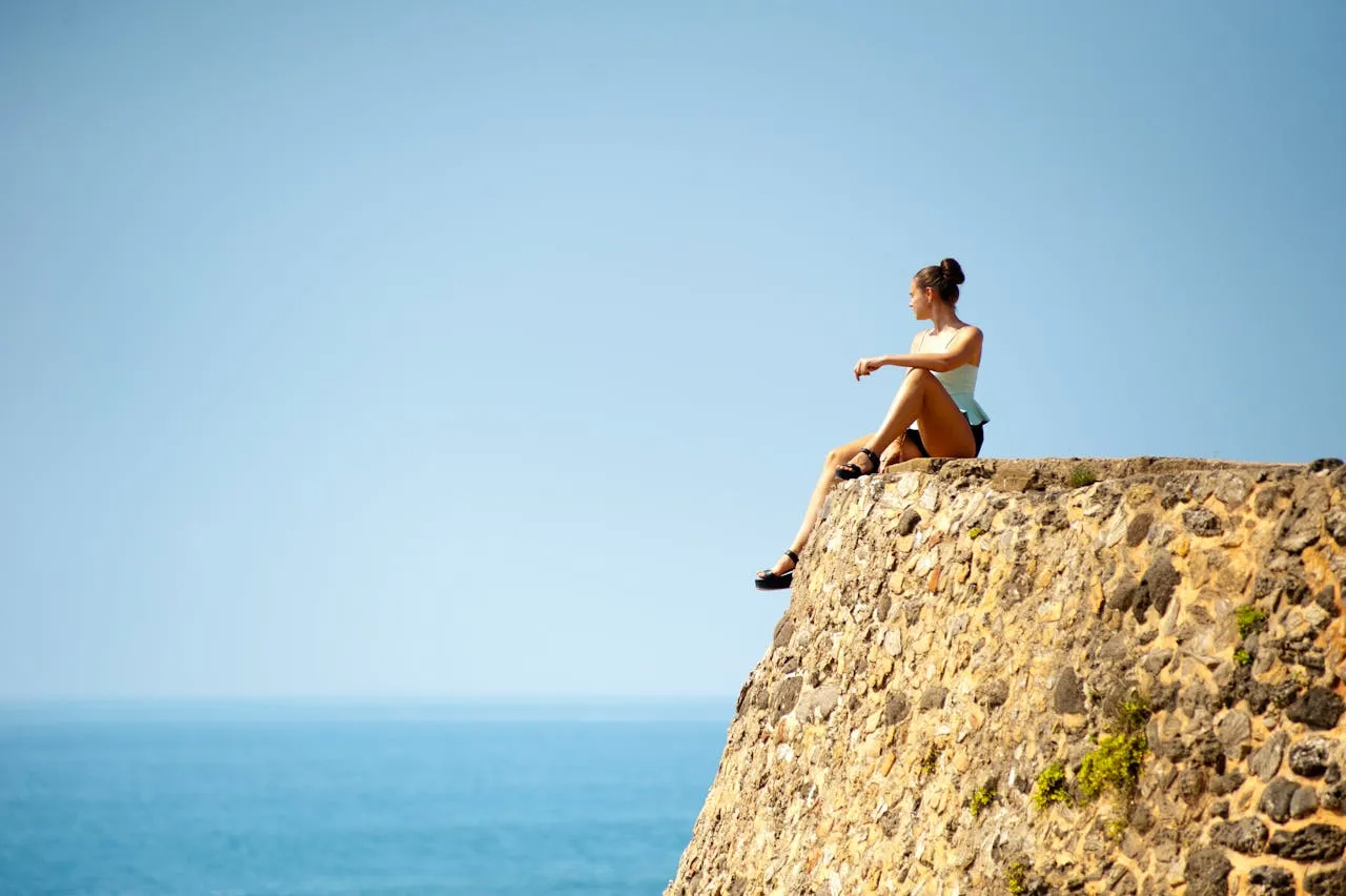 Woman Sitting on Edge Galle Sri Lanka
